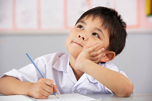 Boy Writing in Uniform